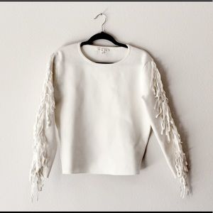 White sweater with fringe sleeves